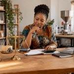 Nigerian business owner reviewing equipment, financial records and profit to estimate the value of her company